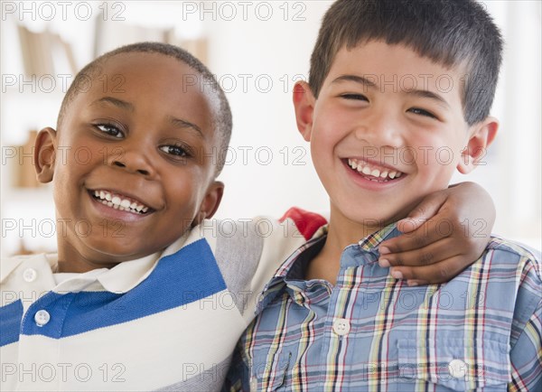 Friends smiling and hugging each other