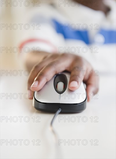 Black boy using computer mouse