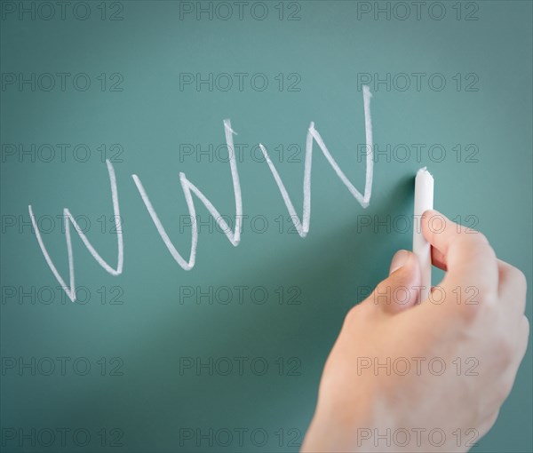 Hand writing WWW on chalk board