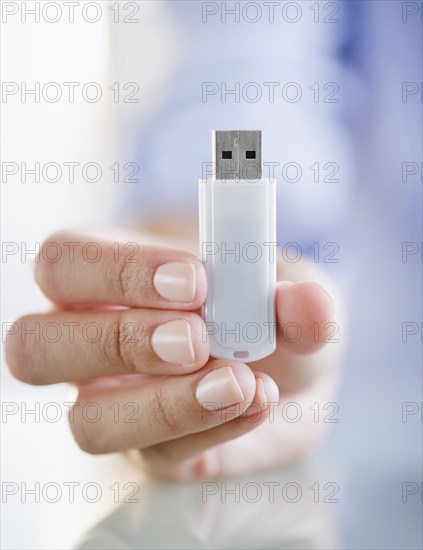 Hand holding USB stick