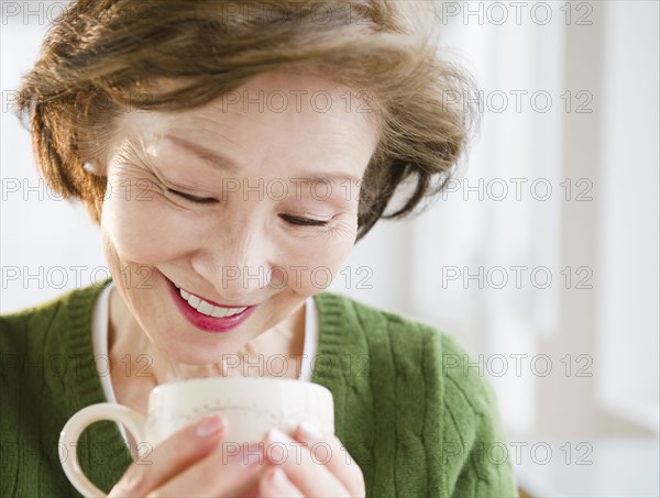 Japanese woman looking into cup