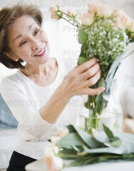 Japanese woman arranging flowers