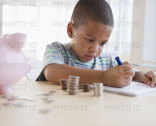 African American boy counting coins