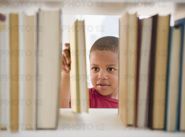 African American boy selecting book