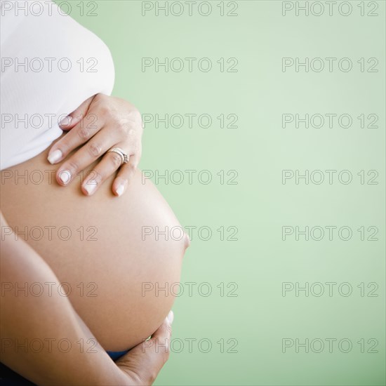 Close up of pregnant Black woman's stomach