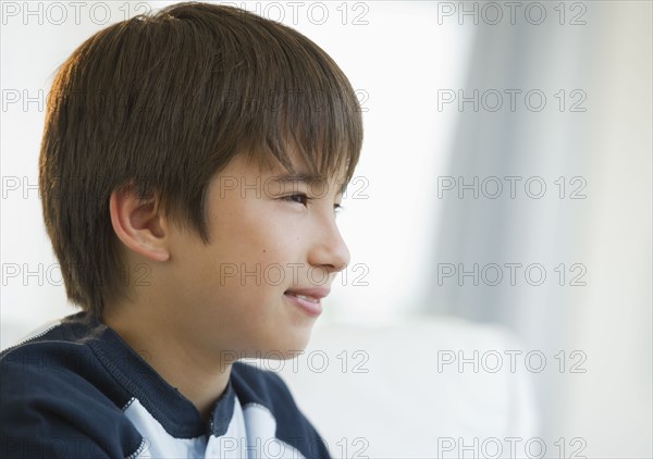 Pensive mixed race boy