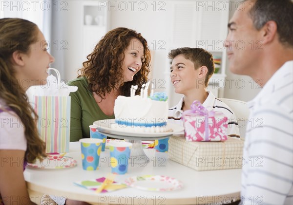 Hispanic family celebrating son's birthday