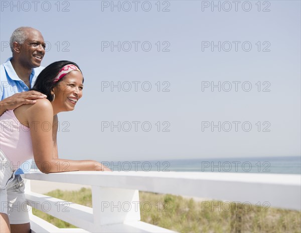 Black couple enjoying beach together