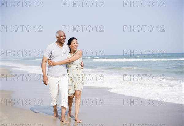 Black couple enjoying beach together