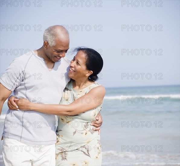 Black couple enjoying beach together
