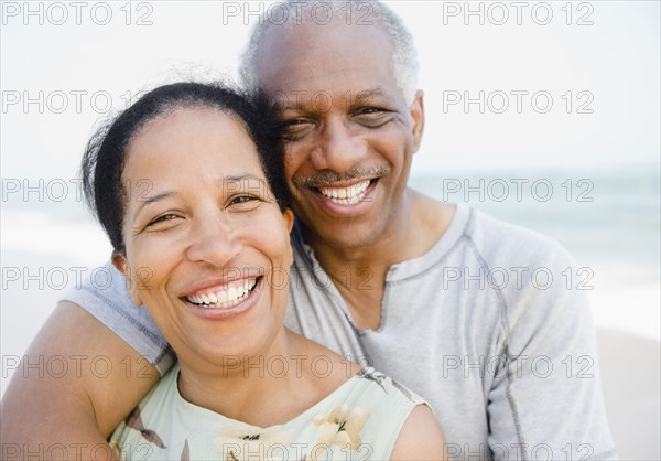 Black couple enjoying beach together