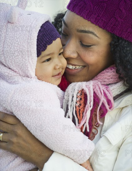 Mixed race woman holding baby