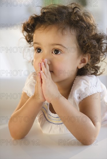 Mixed race girl praying