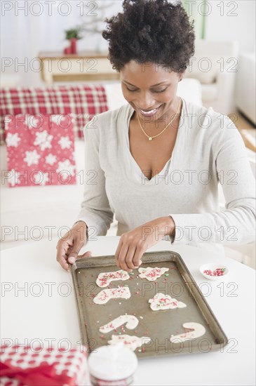 Black woman making Christmas cookies