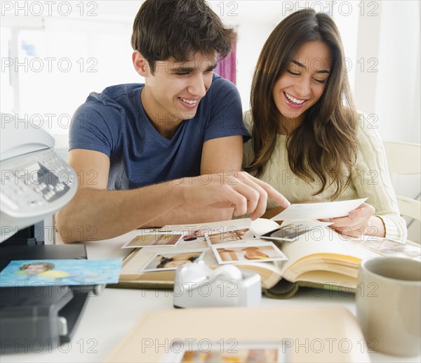 couple looking at photographs together