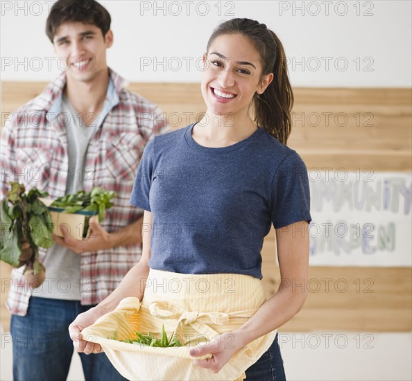 Couple carrying vegetables together