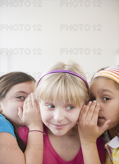 Girls whispering together