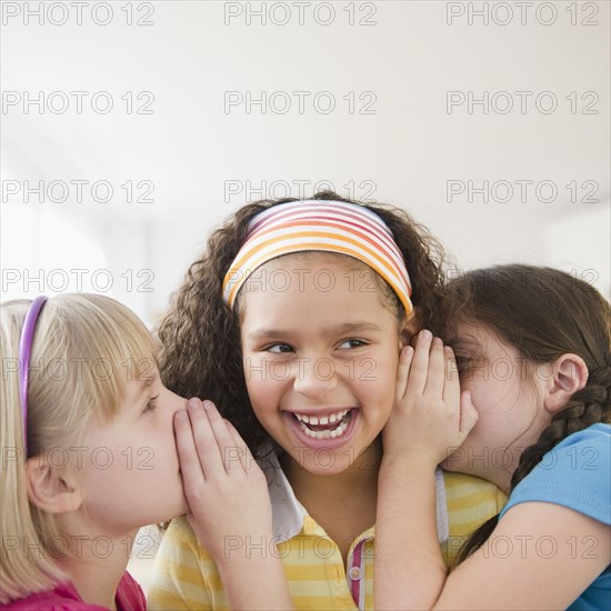 Girls whispering together