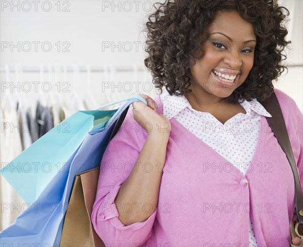 African American woman carrying shopping bag