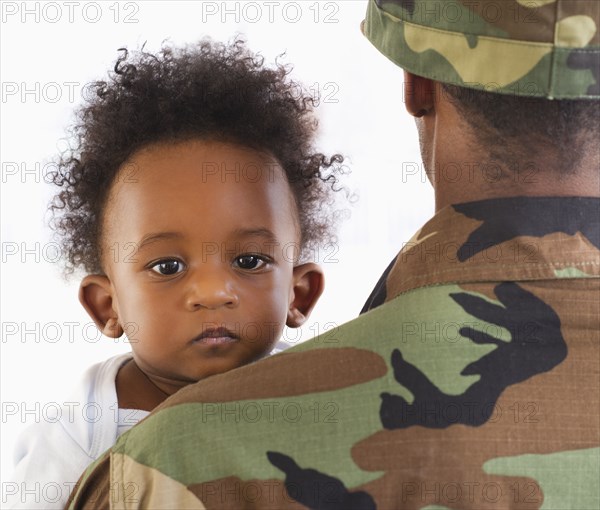 Solder holding African American baby boy