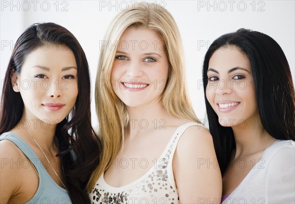 Smiling friends standing together