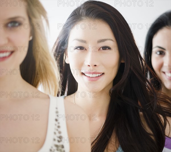 Smiling friends standing together