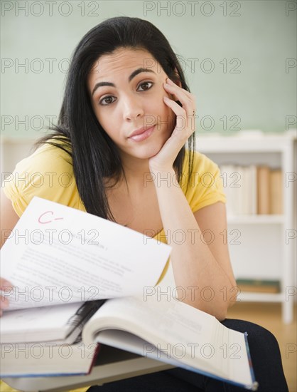 Hispanic woman studying in classroom