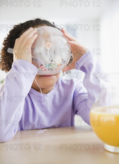 African American girl eating cereal