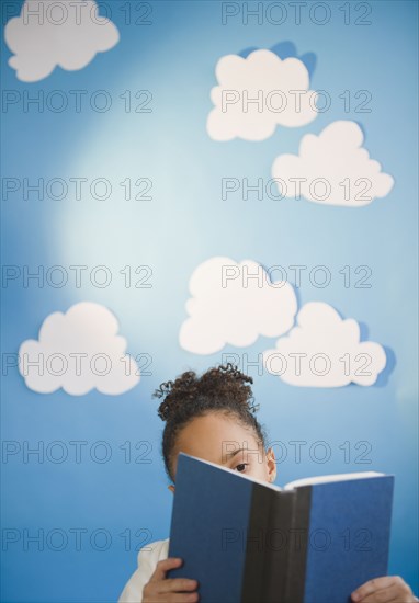 African American girl reading book