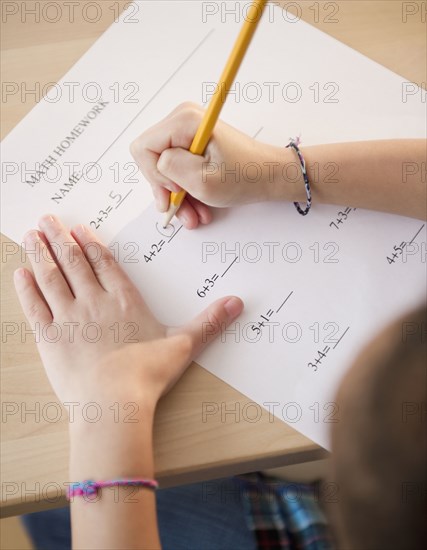 African American girl working on arithmetic homework