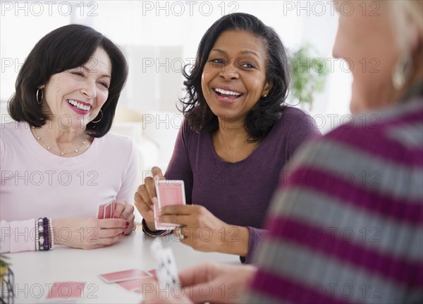 Friends playing cards together