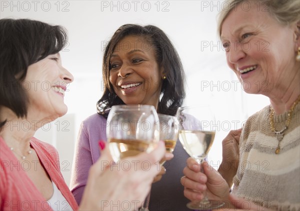 Friends drinking white wine together