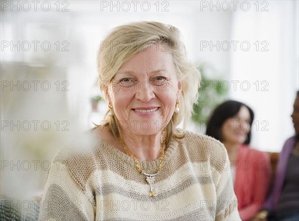 Smiling Caucasian woman with friends