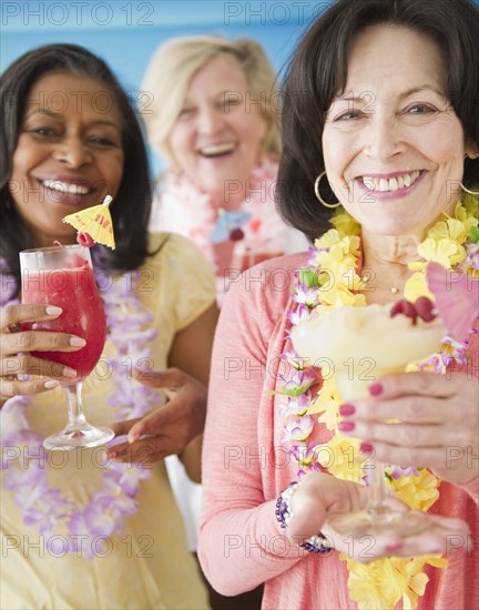 Friends drinking tropical cocktails together