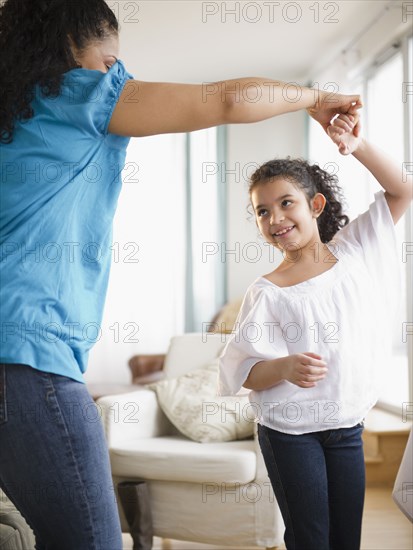 Mother and daughter dancing