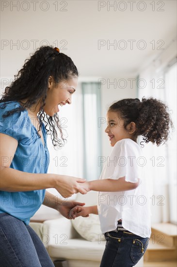 Mother and daughter dancing