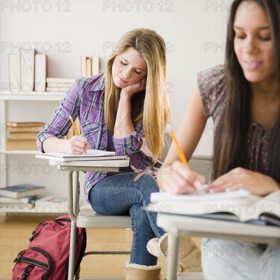 Teenage girls studying in classroom