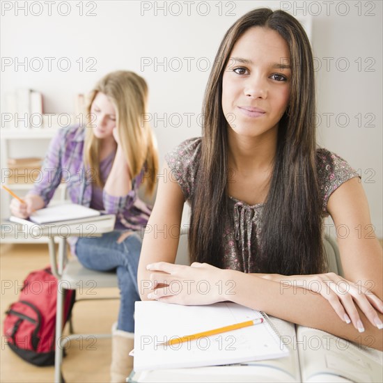 Teenage girls studying in classroom