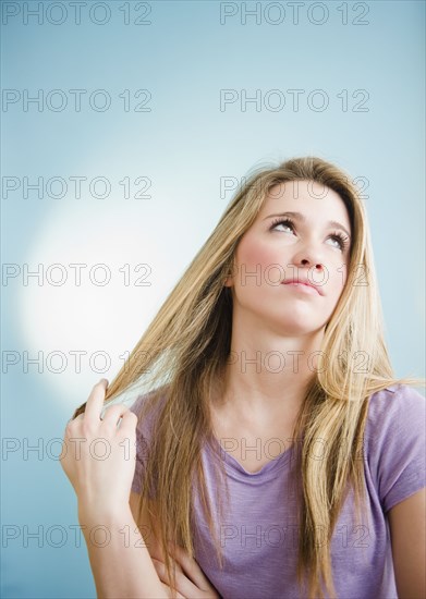Teenage Caucasian girl playing with her hair