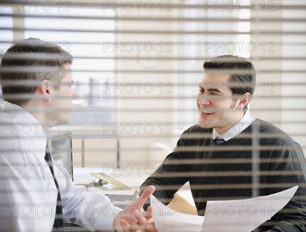 Businessmen working together in office