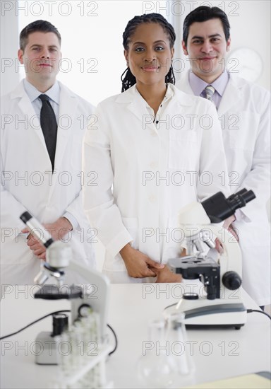 Scientists standing in laboratory