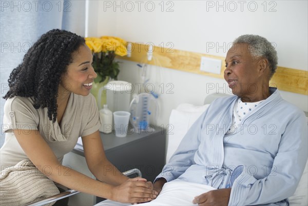 Daughter visiting mother in hospital