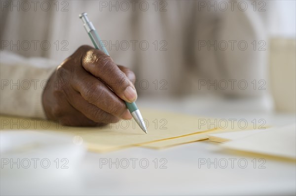 Black woman writing letter