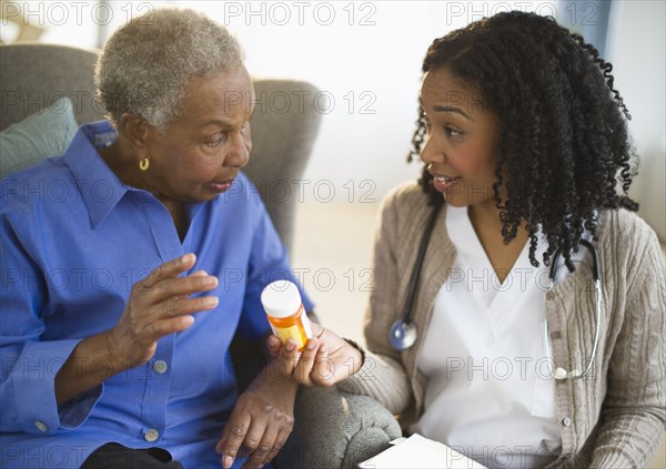 Nurse explaining medication to woman