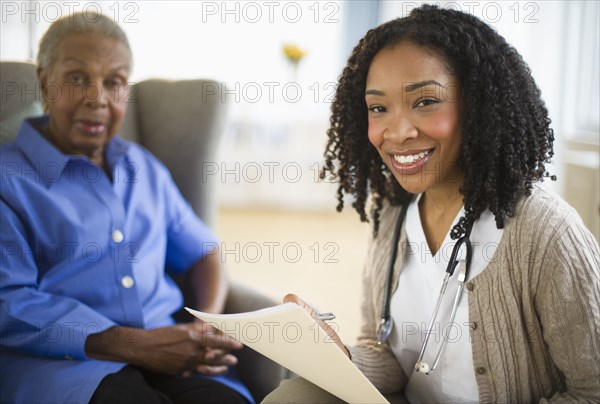 Nurse giving woman checkup