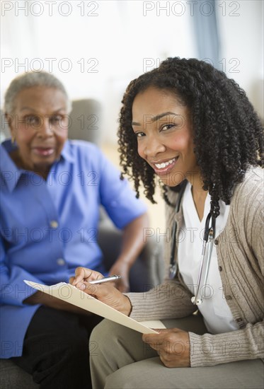 Nurse giving woman checkup