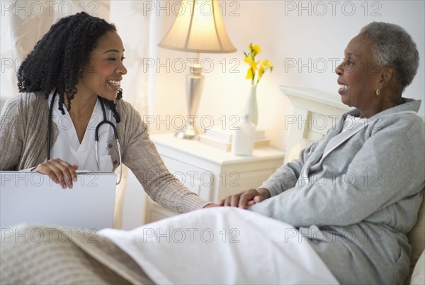 Nurse giving woman checkup