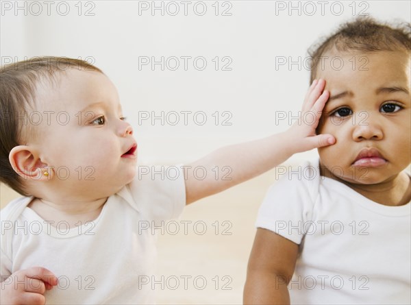 Babies playing together