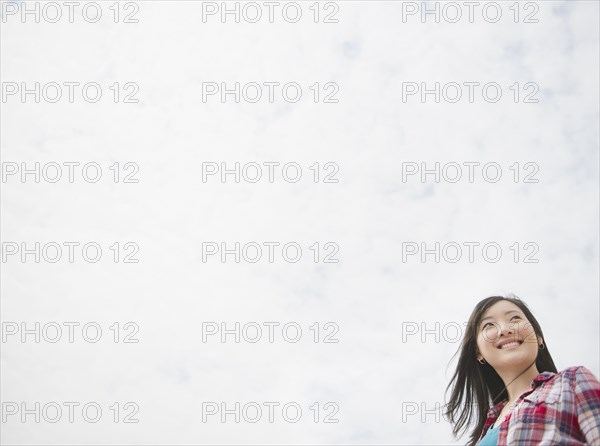 Smiling Korean woman outdoors