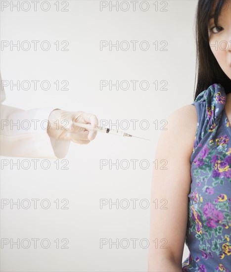 Korean woman receiving injection